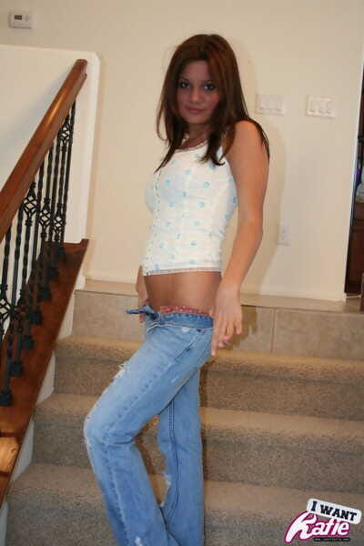 Ebony haired juvenile Kate Tromp uncovers her tight mangos previous to slipping off jeans