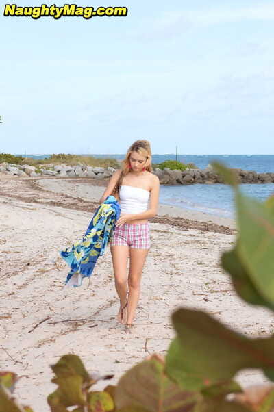 Juvenile princess Michelle Honeywell reveals her firm a-hole even as sunbathing on a beach
