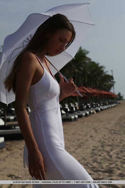 Perspired pretty Elin covers her gorgeous body with sand during going in nature\'s garb at beach