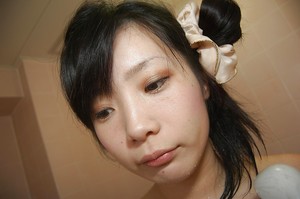 Smiley asian infant with intense tit buttons fascinating bathroom and caressing she is