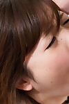 Stunning Japanese schoolgirl deepthroats a rough phallus and receives facialed