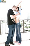 Adolescent instance Bella Ryderr standing in extreme jeans and rides wang