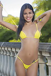 Smiley brunette hair Denisse Gomez drops her lace short skirt on the balcony to pose uncovered
