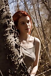 Redhead girl Wanda Ablee can\'t live without to show her mammoth breasts in the forest