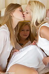 3 attractive young angels remove all white attire to exemplar as mother gave birth on a mattress