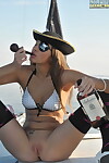 Adolescent dear in ebony  an pirate hat rides a bottle on dominant of a sailboat
