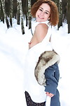 Tiny juvenile dear Lola F undresses nude on snow sheltered path next to the woods