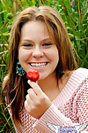 Eighteen year old munches on strawberries afterwards exposing her underwear in aspire grass