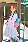 Youthful redhead in pigtails flashes cunt at the playground & toys in socks