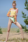 Meager teen Inga takes her clothes off to show her miniature pantoons and cum-hole in the sandy desert