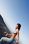 Enchanting eastern girl Yu Satome uncovering her large billibongs outdoor