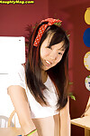 Oriental schoolgirl Lystra shows off her clammy cunt atop kitchen table