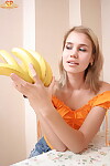 Golden-haired juvenile peels off her clothing sooner than action the same to a banana