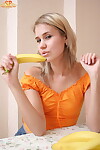 Golden-haired juvenile peels off her clothing sooner than action the same to a banana