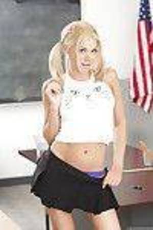 Golden-haired solo girl Riley Steele flashing constricted schoolgirl ass in thong panties