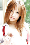 Adorable oriental schoolgirl Reika Shina erotic dancing off her uniform