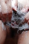 Asian adolescent pleasing baths and exposing her soapy pussy in close up