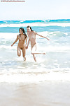 Amateur models Carly T and Silvie bare naked teen bodies at the beach