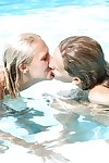 Barely legal lesbian Sara J and her girlfriend share tongue kiss in pool