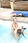 Topless blonde Sara J seduces her teen girlfriend into lesbian sex in pool