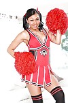 Ebony cheerleader babe poses gorgeously in her sexy red outfit