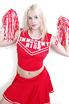 Schoolgirl cheerleader Kylee is a blonde babe that is undressing for us