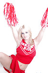 Schoolgirl cheerleader Kylee is a blonde babe that is undressing for us