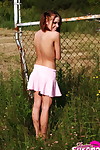 Teen redhead Beautiful Serena falls a petticoat over her belt clothes waste in a field