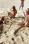 Undressed teen young darlings in sunglasses having some enjoyment on the beach