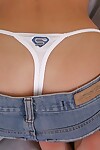 Appealing golden-haired pretty Jannah Burnham flashes her apple bottoms in white strap close up