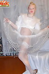 Teen looking model with red lips dons MILFs wedding costume for vibrator activity