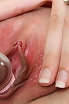 Slight youthful infant stretching to implement her cum-hole with a glass penis stimulator close up