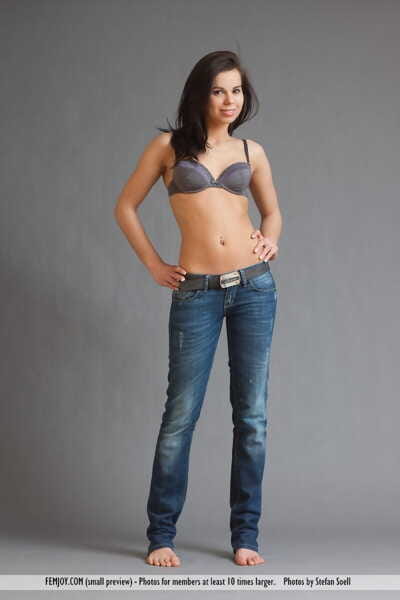 Murky haired young Ferrera removes her boob coverer and jeans for a unclothed modeling session