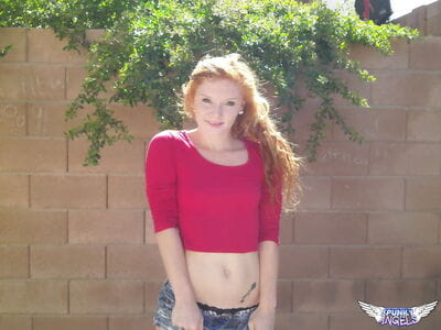 Moist redhead Alex Tanner flashes her undersize zeppelins outdoors and drops her underclothing