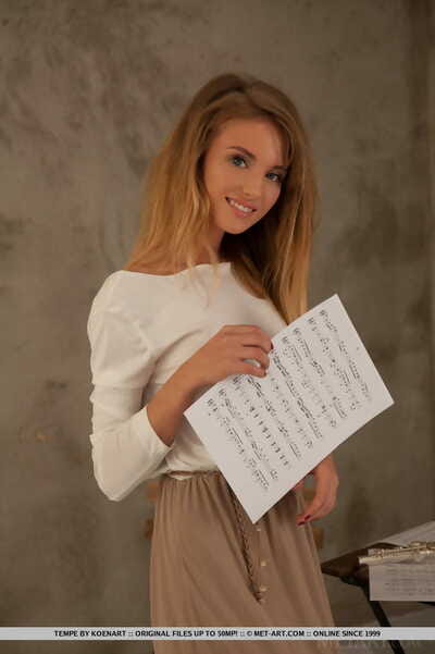 Mini flutist Tempe attains completely undressed between scattered sheet music
