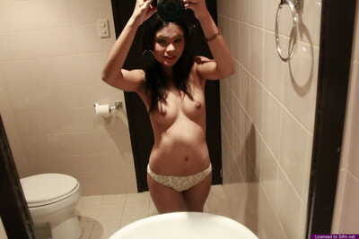 Mini Japanese angel removes her underclothing for wholly as was born self shots in shower-room