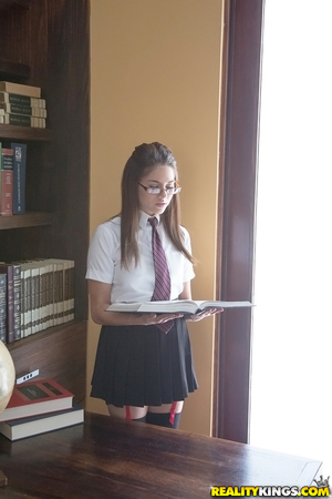 Seductive teenage dark hair slipping off her school uniform