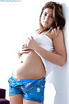 Perspired infant youthful Mirabelle removing blouse and panties to pattern in stripped