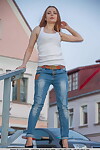 Dressed angel in denim jeans exposing little mambos for glamour photo amplify