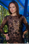 Erotic exemplar Bogdana B squats outside in sheer lace dominant swelling her legs