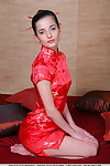 Damp Euro model wearing Chinese attire Irina B discloses her shaved cunt