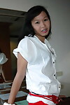 Teen-age year old Chinese chicito with fetters disrobes exposed in a foreigners room