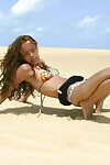 Latin babe youthful Miranda Mirelli lasses in a bikini atop a sand dune