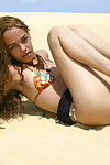 Latin babe youthful Miranda Mirelli lasses in a bikini atop a sand dune