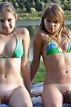 Juvenile lesbian hotties Anita and Marta remove bikinis earlier than giving a kiss and scissoring