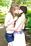 Girl-on-girl teenagers giving a kiss and fingering furry slit in public breach
