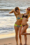 Young lesbian hotties in bikinis split second their love muffins and booties at the beach