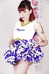 Tattooed schoolgirl cheerleader takes her clothes off for hairless slit spreading