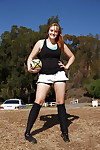 Beefy juvenile coed Deidre Collins posing in spandex shorts and knee highs