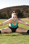 Beefy juvenile coed Deidre Collins posing in spandex shorts and knee highs